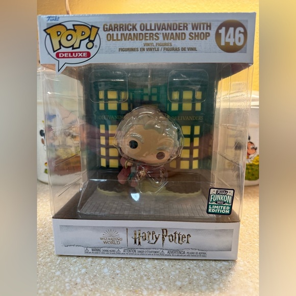 Funko Pop Deluxe Garrick Ollivander with Wand Shop - Picture 1 of 11